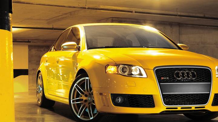 Audi RS4 Cabriolet Front Pose In Yellow In Garage